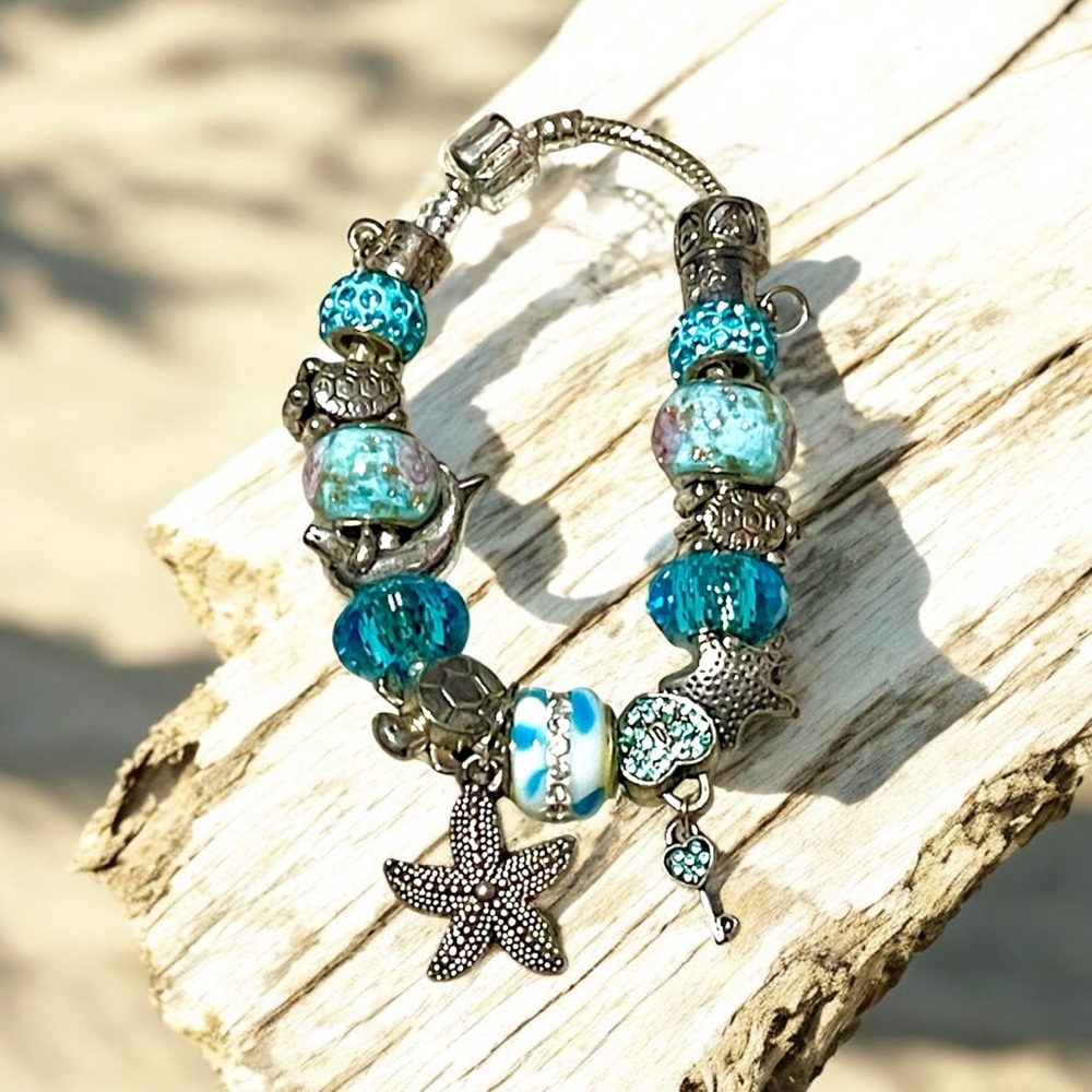 Ocean life silver and blue charm bracelet with dolphins turtles and starfish
